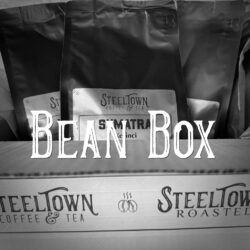3 bags of coffee beans in a box